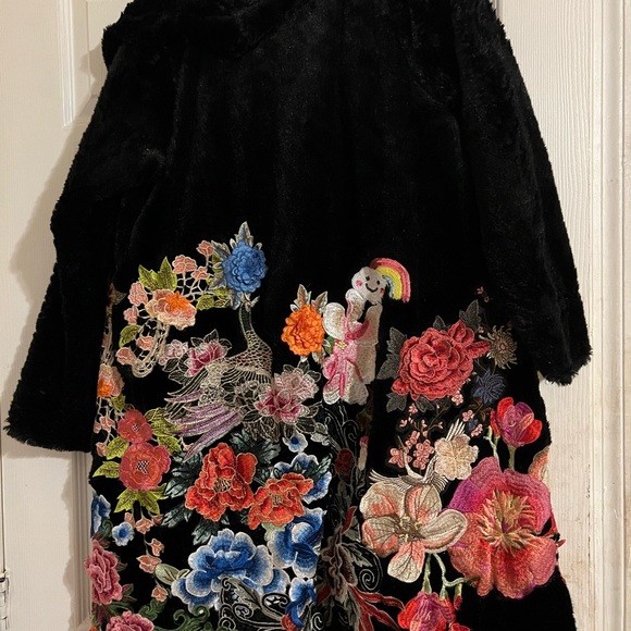 Johnny was coat size xs color black. Flowers peacock etc